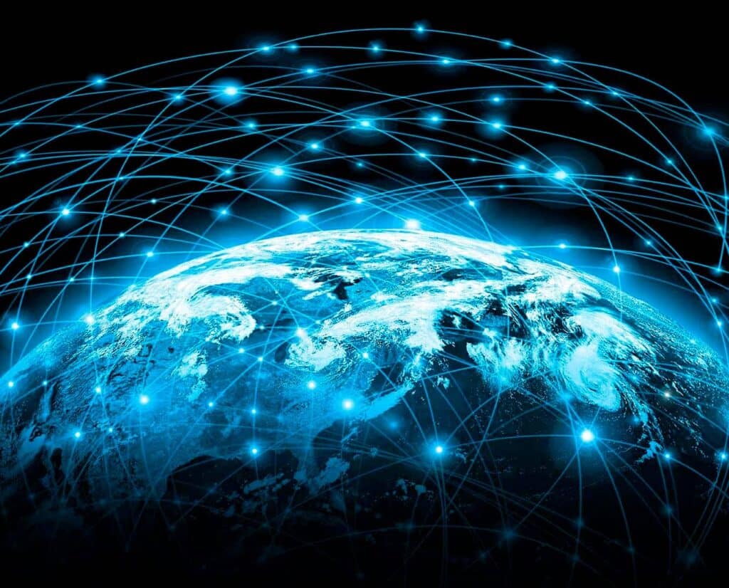Glowing blue network lines arch over the Earth representing communication across the globe