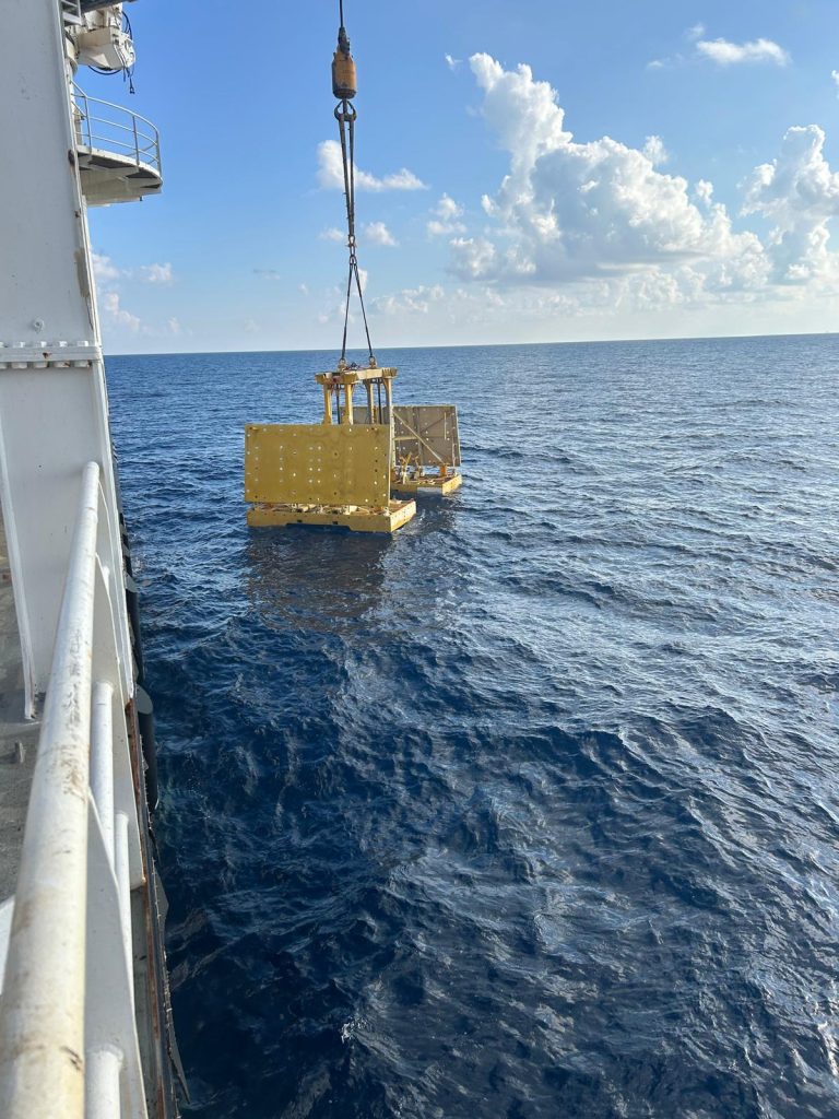 Pipe lift frame being overboarded with mud mats up.