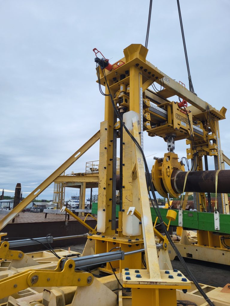 Pipe lift frame holding pipeline on deck.