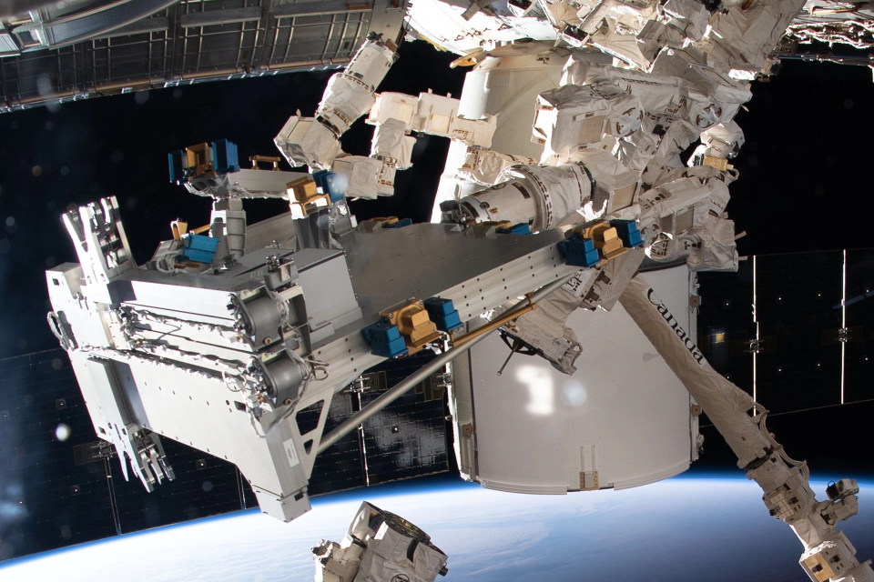 Gold2ISSV2 GOLD 2 devices on the Bartolomeo on the International Space Station ISS with curvature of Earth in background
