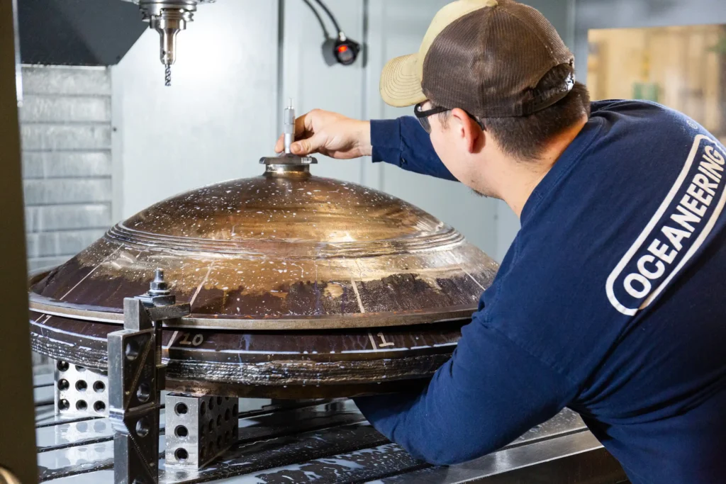Machinist performing in process inspections on Virginia class submarine hatch