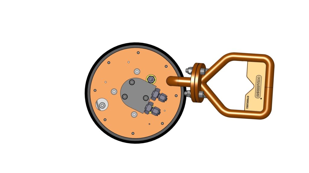 Top view of multipurpose cleaning tool showing the circular body, mounted fittings, and lifting handle.