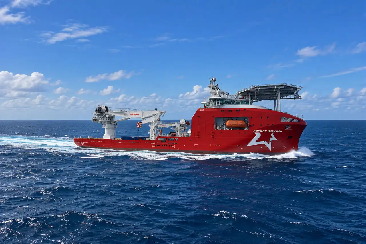 The Multi-Service vessel "Energy Savannah" sailing at sea, viewed from above, with a helicopter landing deck and heavy-lift crane visible on deck.
