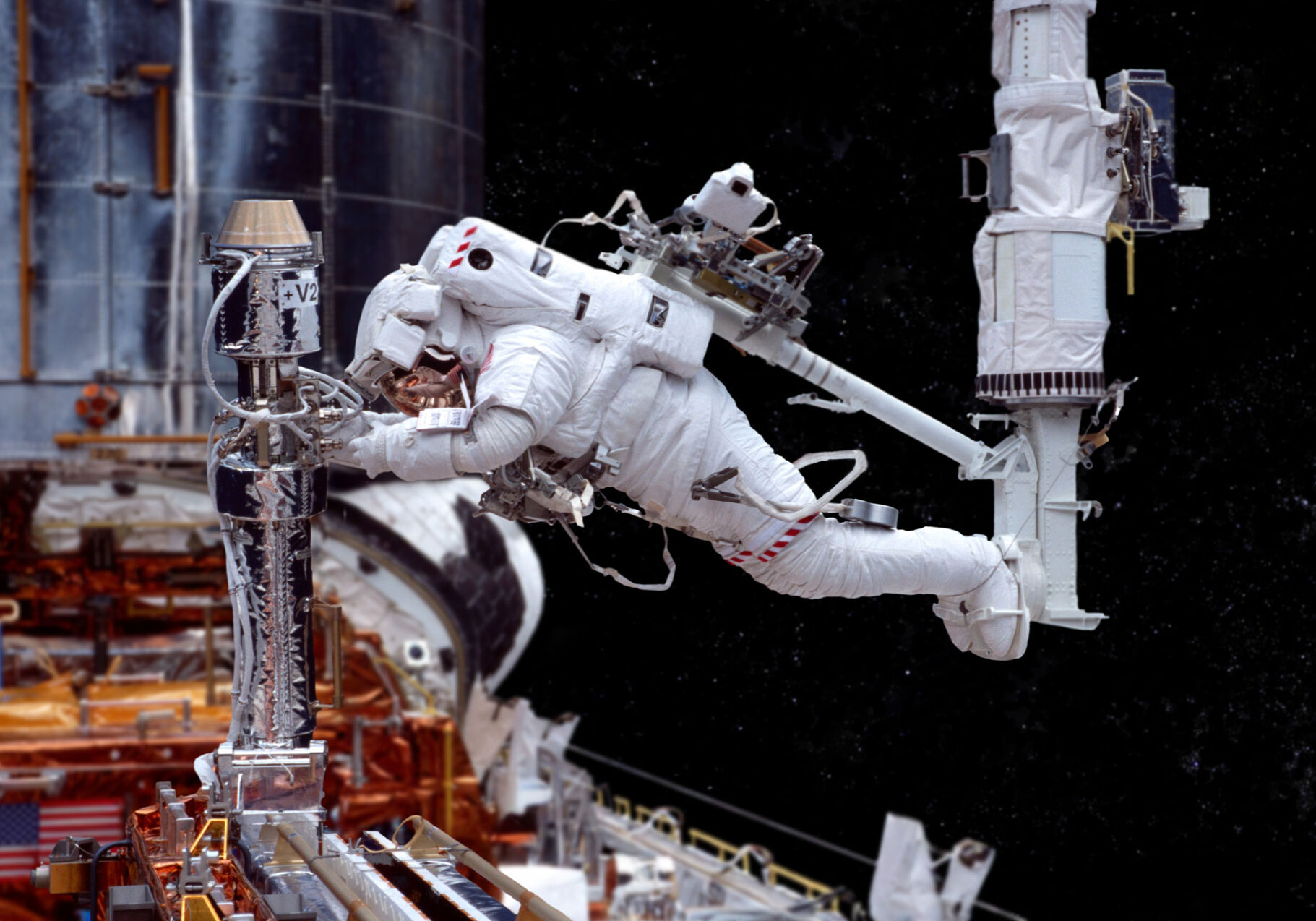 CrewusingWaistTethercopy Astronaut using a waist tether to perform work outside of the International Space Station ISS