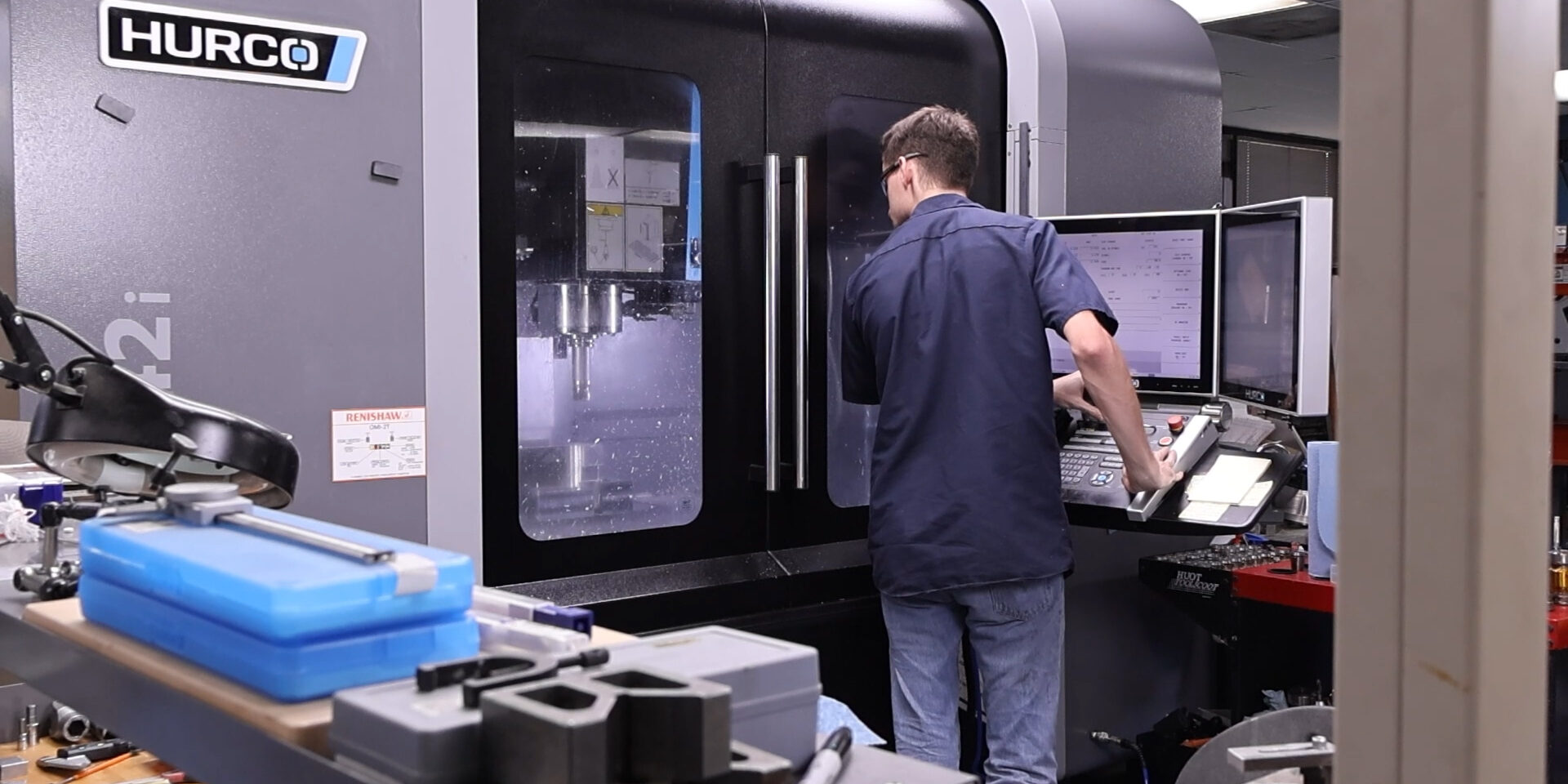 MShop3 Technician using CNC lathe machine in Oceaneering manufacturing facility
