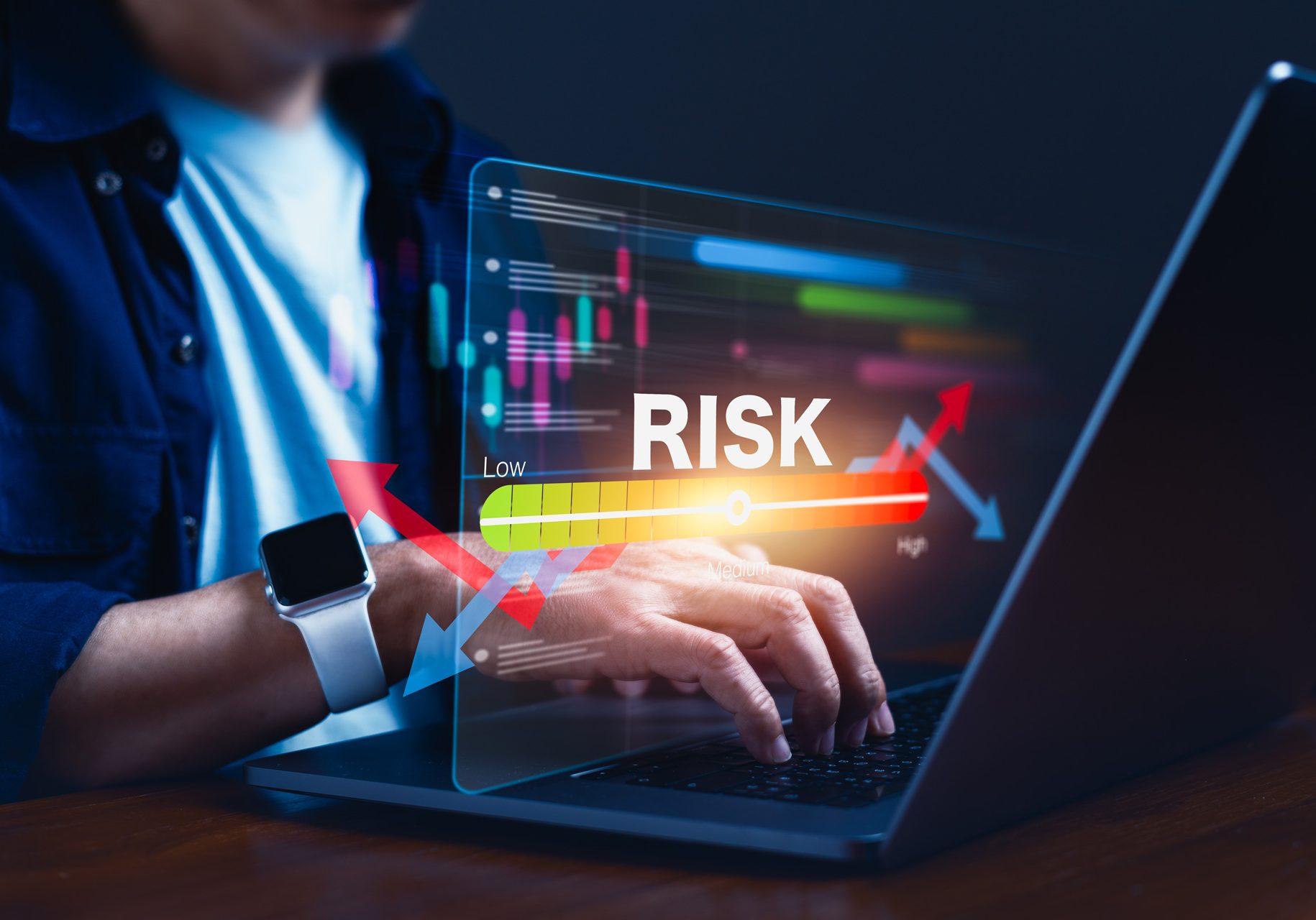 Man using laptop to measure risk