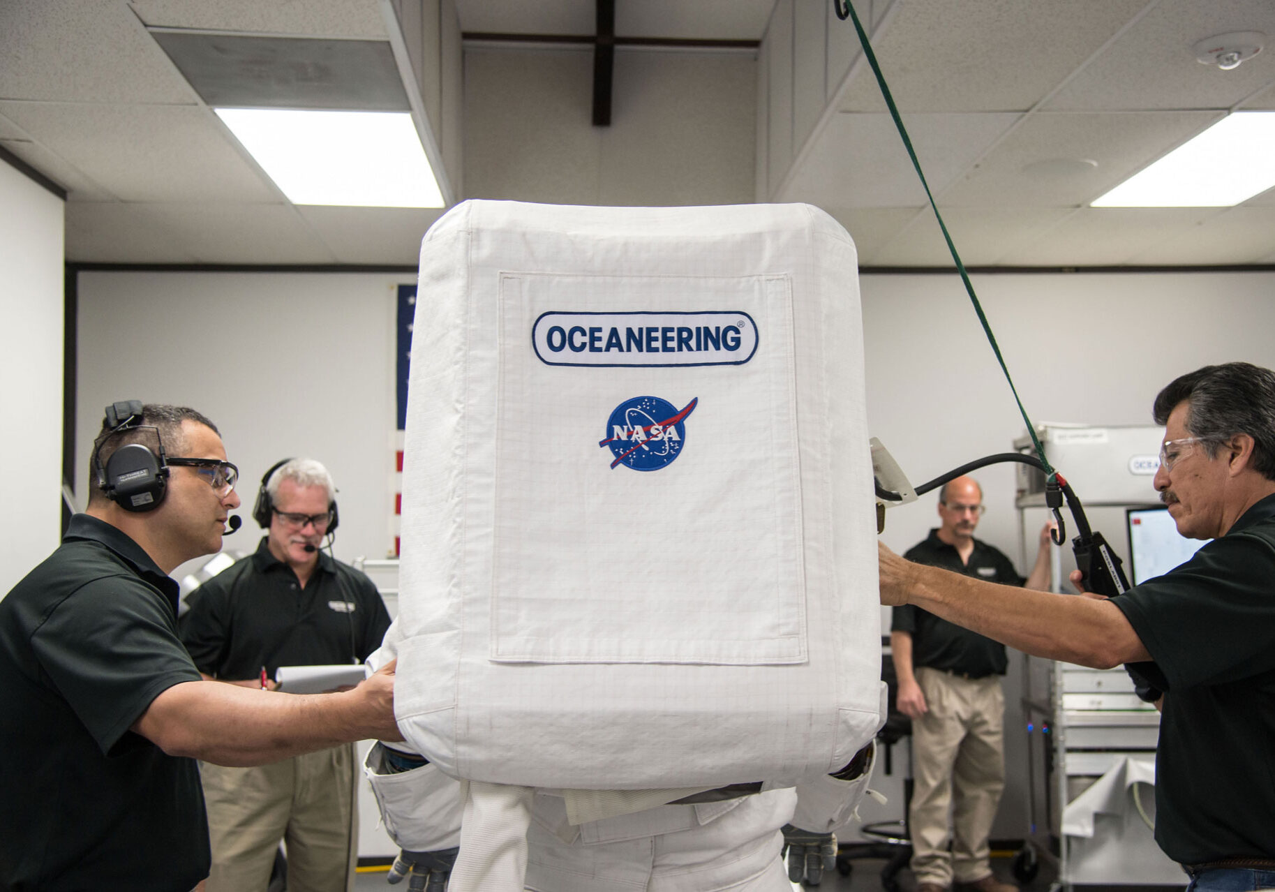 jsc2015e077521 Oceaneering engineers testing the astronaut life support equipment