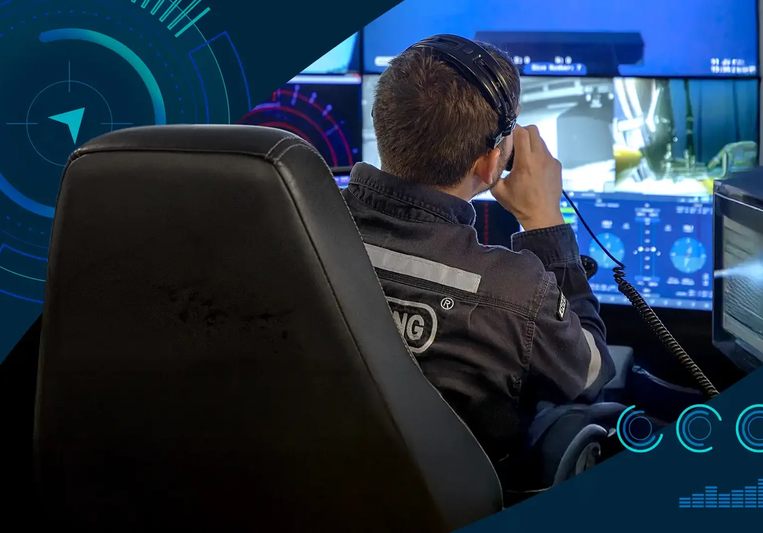 Control room operator seated at workstation monitoring subsea operations on multiple screens
