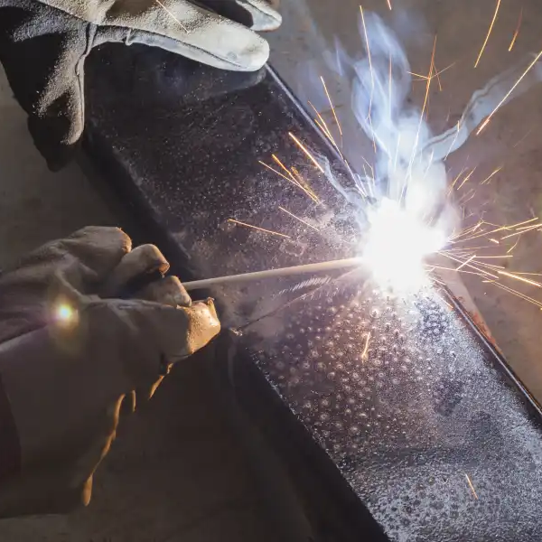 Shield metal arc welding on joint steel in manufacturing facility
