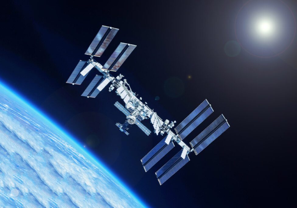 ISS over planet earth. Shutterstock image